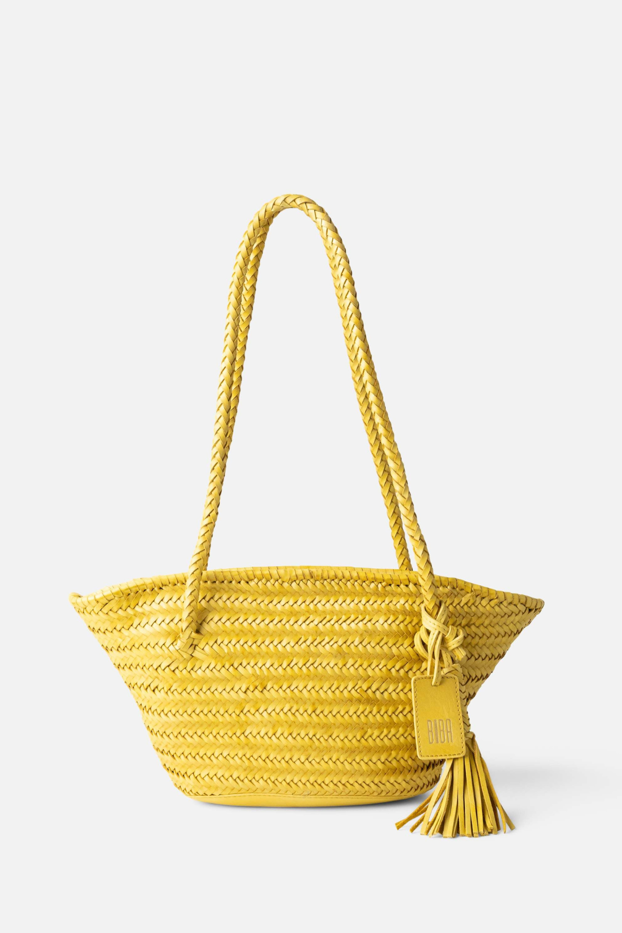 Panier BIBA en cuir tressé jaune avec anses tressées et pompon décoratif