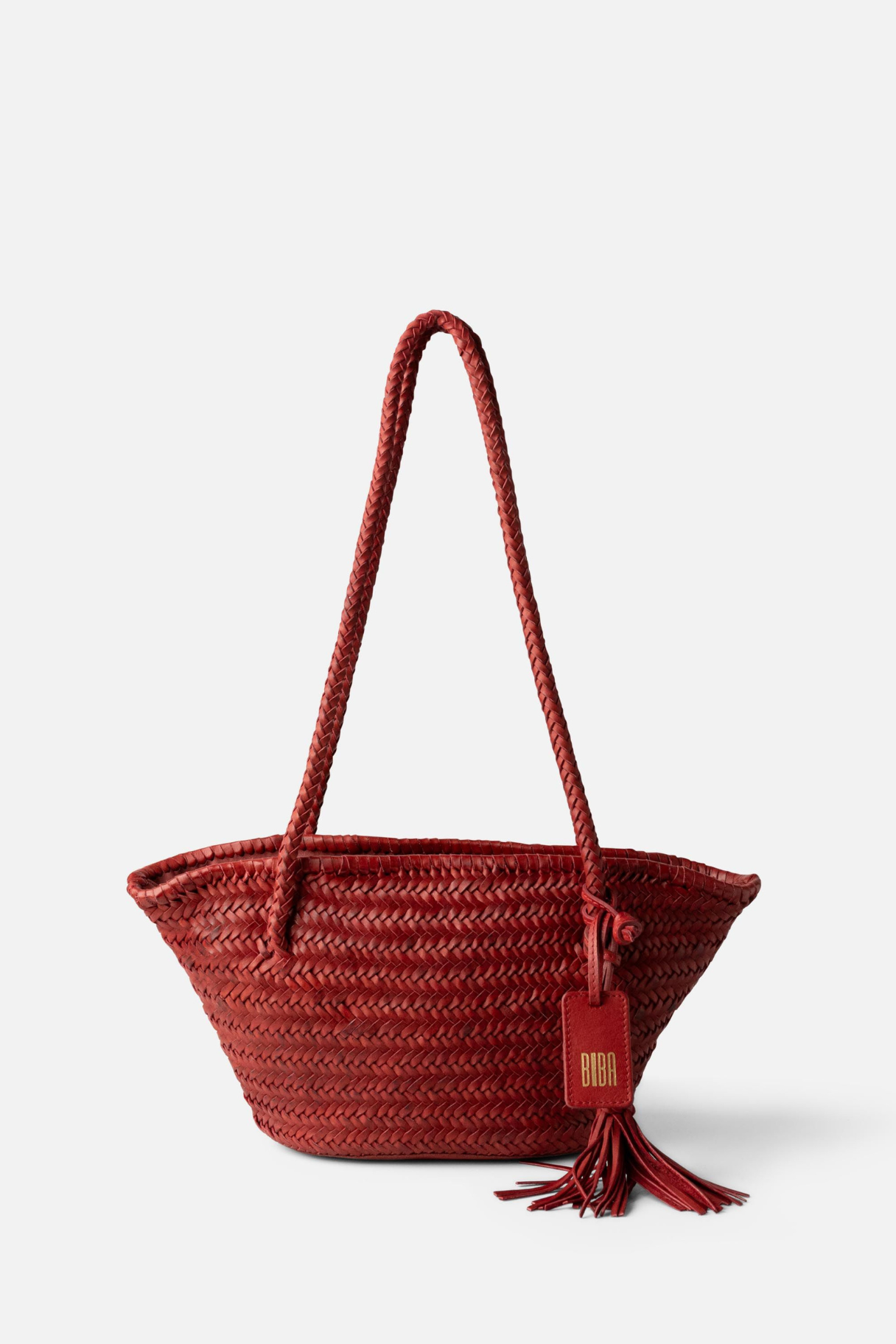 Panier BIBA en cuir tressé rouge terracotta avec anses tressées et pompon décoratif