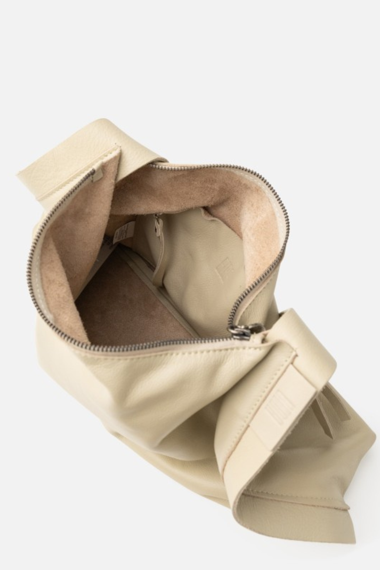 Intérieur du sac hobo cuir écru avec doublure suède et poche zippée intérieure